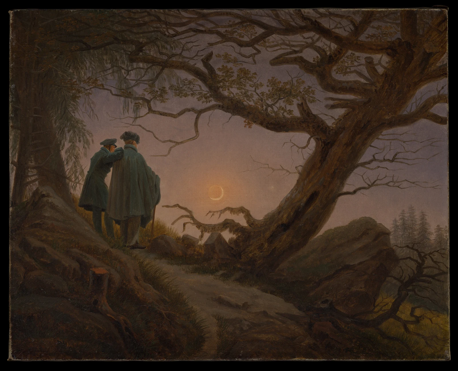 Two figures seen from behind stand on a rocky path beneath trees, looking toward the moon; one rests a hand on the other’s shoulder.
